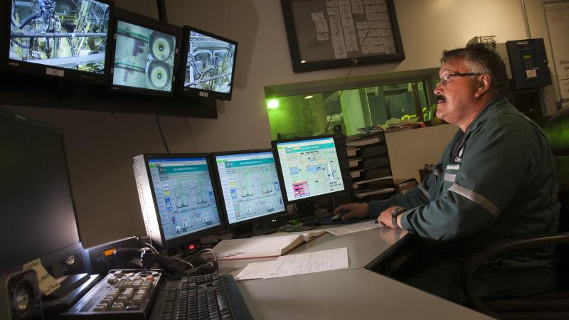 Person staring at multiple monitors