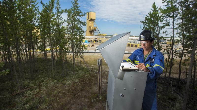 Person wearing hardhat conducting an inspection